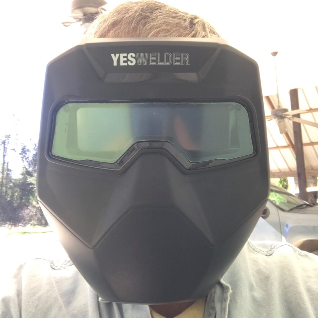 Picture of me wearing welding goggles.