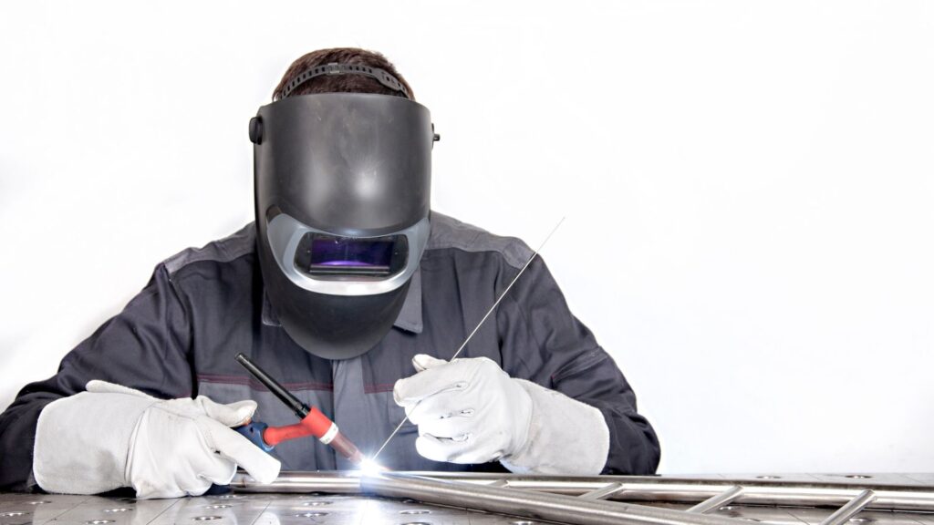 Picture of a person welding aluminum.