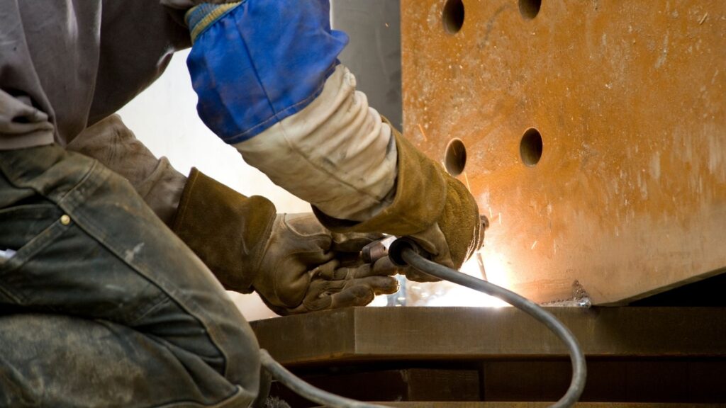 Picture of a person stick welding.
