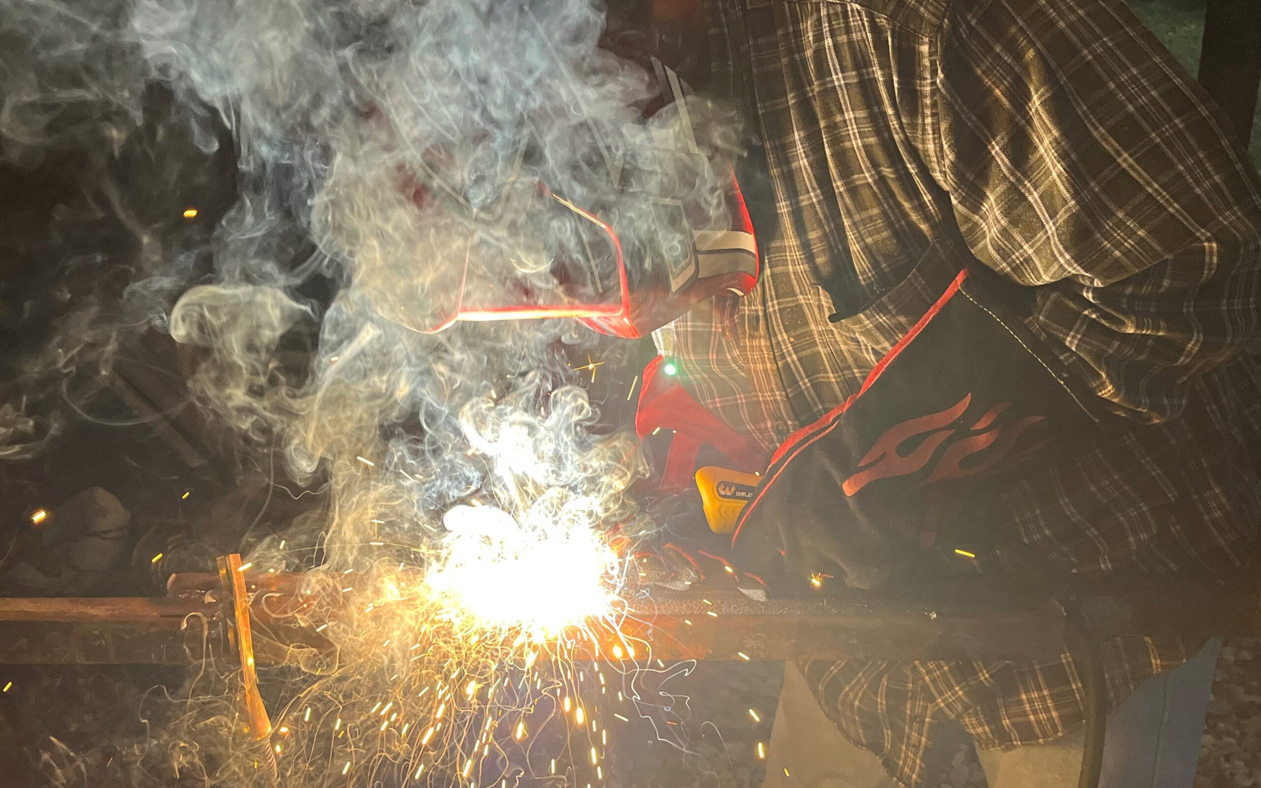 Picture of welding fumes surrounding a welder.